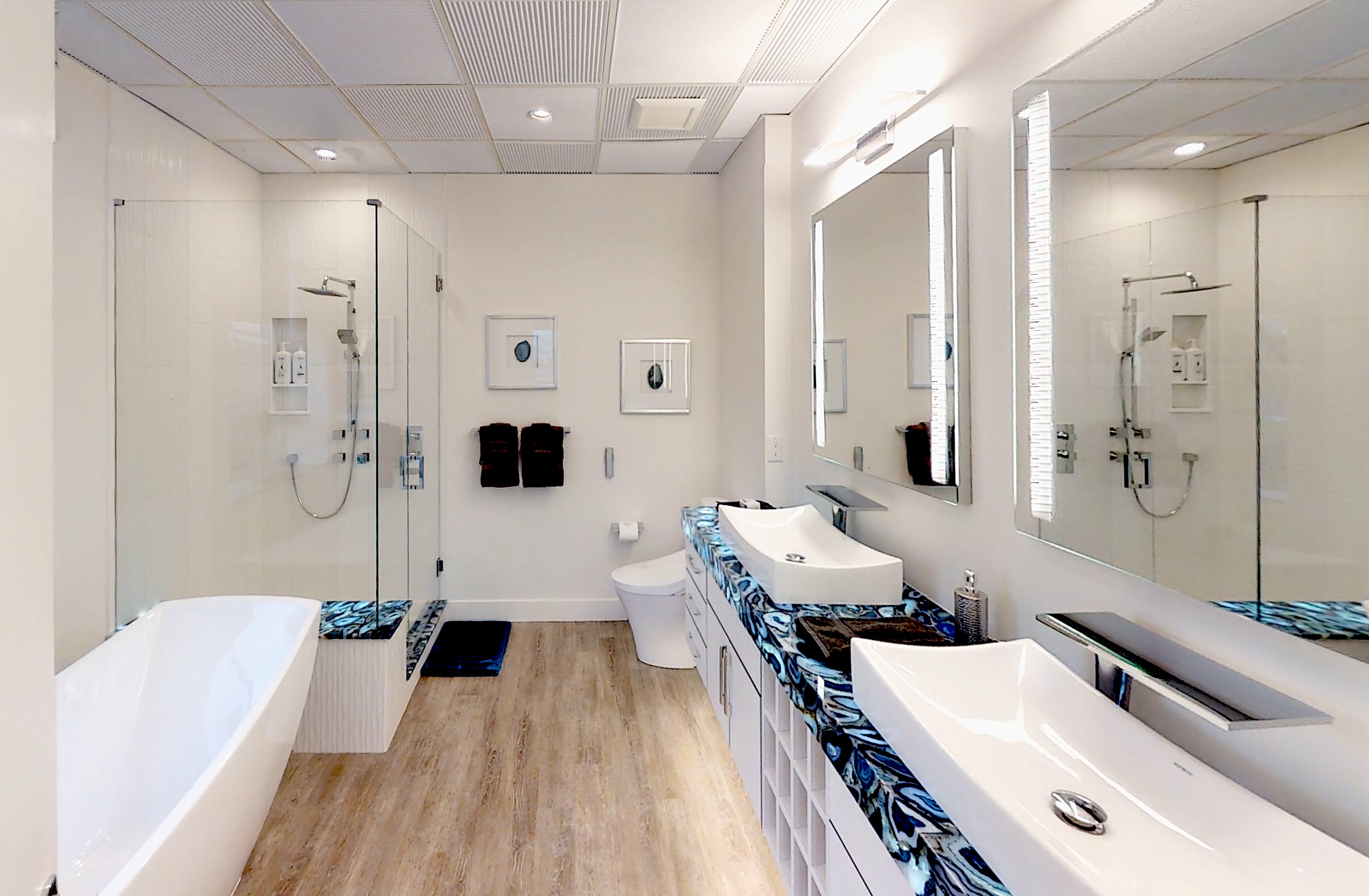 A white bathroom meets a stunningly original countertop.