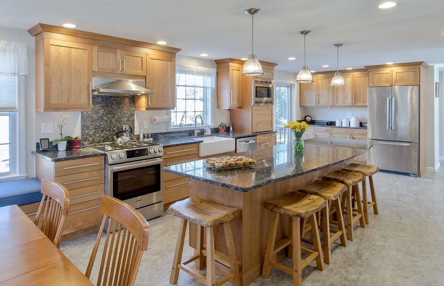 Curved island seating is among this custom kitchens many elegant features.