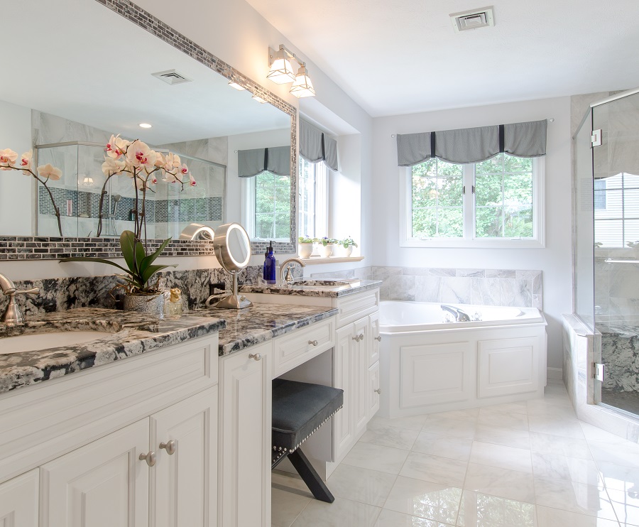 Heavenly white cabinets brighten this personal sanctuary. Ask about our Dream Bathroom remodelling!