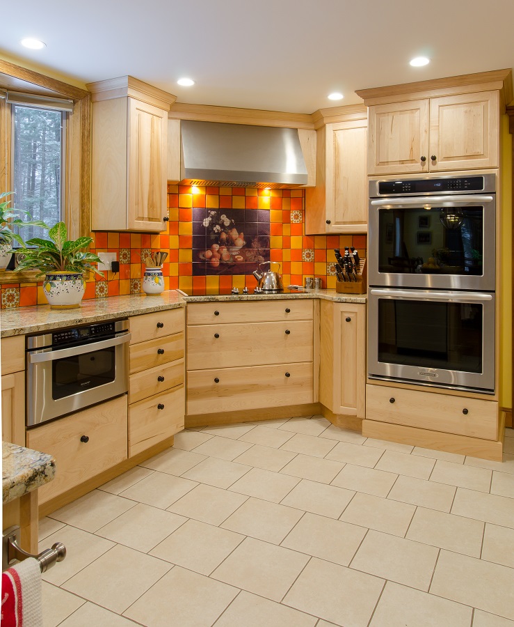 This bold yellow and orange tile backsplash makes an exciting statement piece.