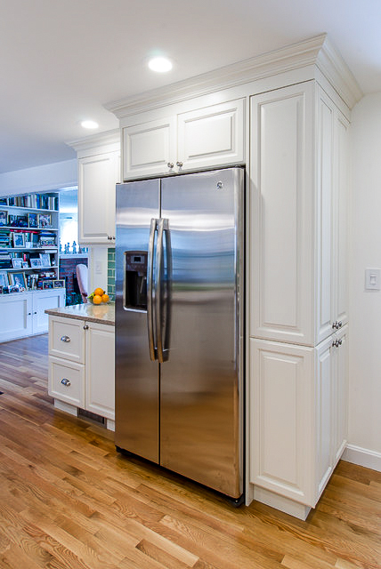 Custom white kitchen cabinets and a brand new pantry.