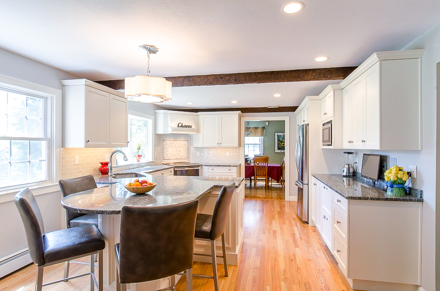 Kitchen designs for white kitchen remodel. New cabinets and countertops completely transform this home. 